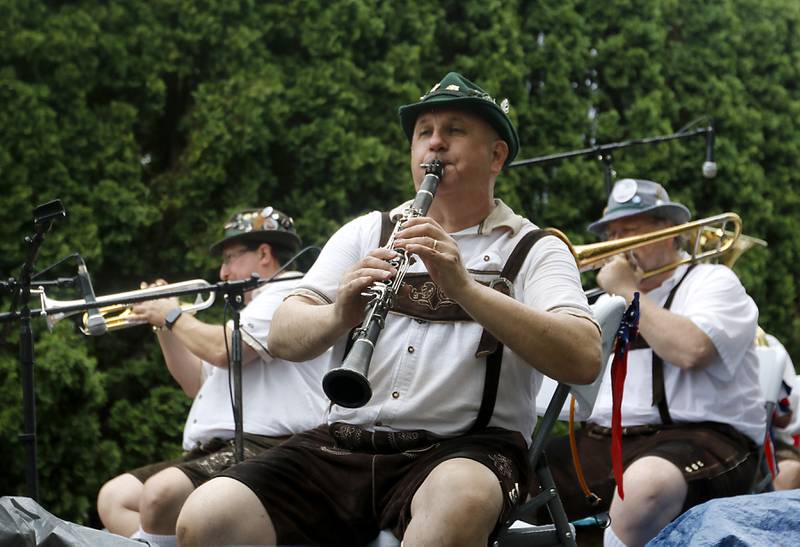 Mike Knauf and other members of the Die Musikmeisters German Band play poker music on Sunday, July 7, 2024, during Crystal Lake’s annual Independence Day Parade on Dole Avenue in Crystal Lake. This year’s parade feature close to 100 units.