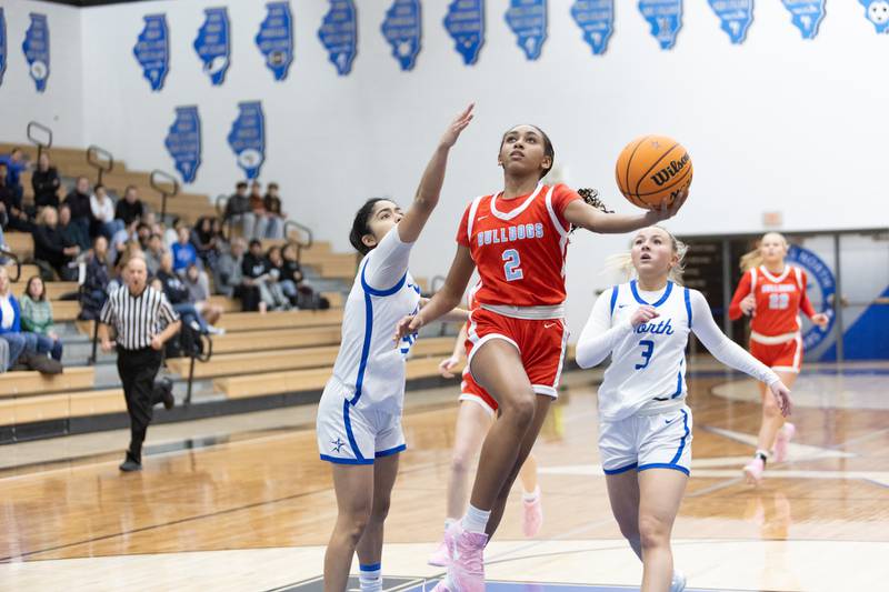 Batavia's Sidnee Justice goes in for a layup against St. Charles North on Friday, Dec.12,2025 in st. Charles.