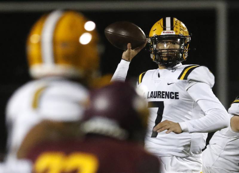 St. Laurence's Chase Kwiatkowski throws the ball during an IHSA Class 4A first-round football game Richmond-Burton against Richmond-Burton on Friday, Nov. 1, 2024, at Richmond-Burton High School in Richmond.