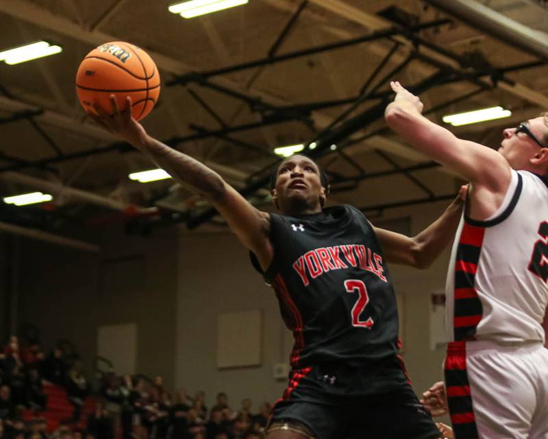 Yorkville's Alonn Flint (2) puts up a shot at the basket during their Class 4A Bolingbrook Sectional semifinal basketball game between Yorkville at Benet, March 3, 2026 in Bolingbrook.