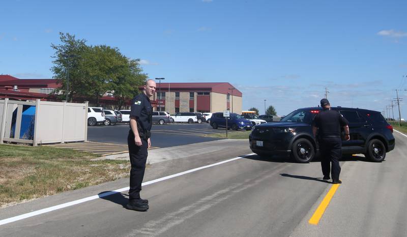 Ottawa Police officers block the entrance to Wallace Grade School along North 33rd Road on Wednesday, Aug. 30, 2023 north of Ottawa. La Salle County Sheriff, Wallace Fire Department, Illinois State Police and Ottawa Police Department were called to the school shortly after a student who ran ran out of the school and into a cornfield.