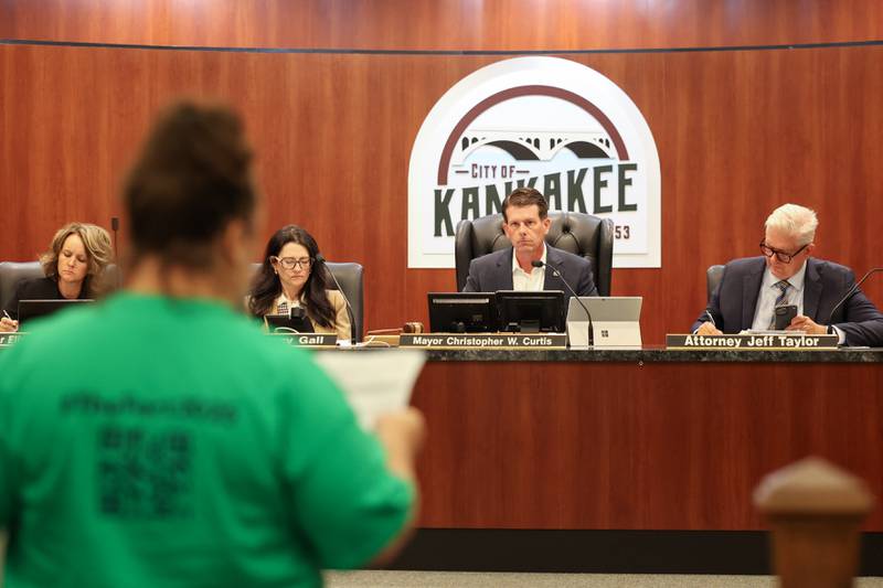 Kankakee Mayor Chris Curtis listens to a Fortitude Community Outreach supporter ahead of the city council's vote on a conditional use permit to allow Fortitude to operate a shelter at 970 E. Court St. in Kankakee during the meeting on Monday, Sept. 15, 2025. The conditional use permit request was rejected by a 12-0 vote.