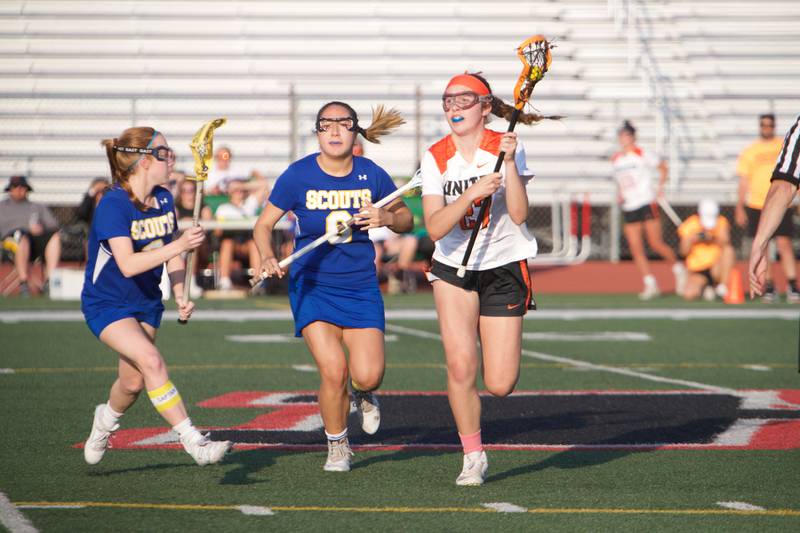 Crystal Lake Central's Anna Starr looks to advance the ball  against Lake Forest's Megan Rocklein (2) and Chelsea Tzau (6)  at the Super Sectional Final on Tuesday, May 30, 2023 in Huntley.