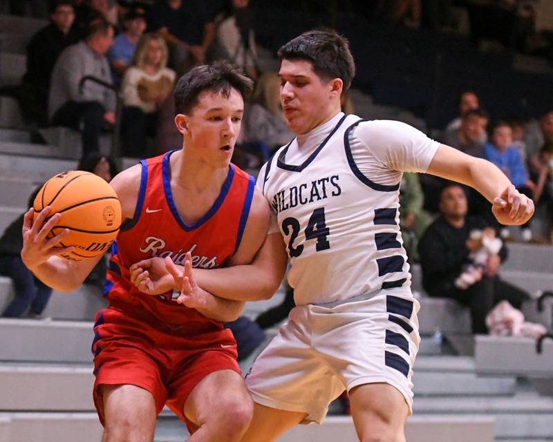 Glenbard South's Will Sieck, left, tries to get past West Chicago's defender Oliver Muñoz (24) during the game on Friday Jan. 3, 2025, held at West Chicago High School.