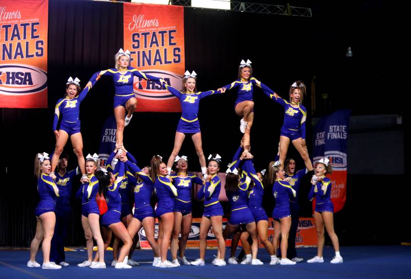 Members of the Lyons Township cheerleading team compete in the coed team division of the IHSA State Finals on Saturday, Feb. 8, 2025 at Grossinger Motors Arena in Bloomington.