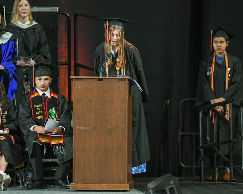Graduating DeKalb High School senior Carly Kammes recognizes DeKalb School District 428 staff on Saturday, May 24, 2025, during the Class of 2025 Commencement ceremony held at the NIU Convocation Center in DeKalb.