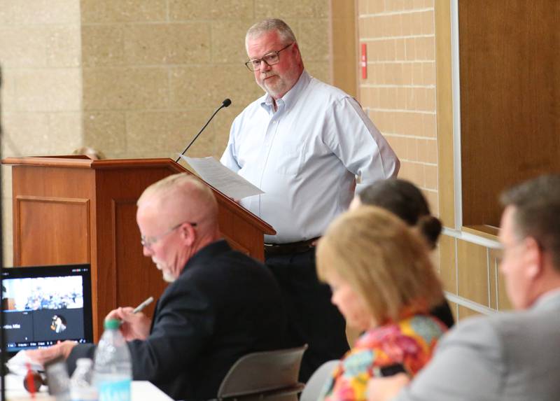 Dr. Brian Rosborough, a family medicine physician in Ottawa, speaks to the Illinois Health Facilities and Services Review Board during a public hearing regarding OSF St. Elizabeth Hospital's plans to reduce services on Tuesday, June 10, at Central Intermediate School in Ottawa.