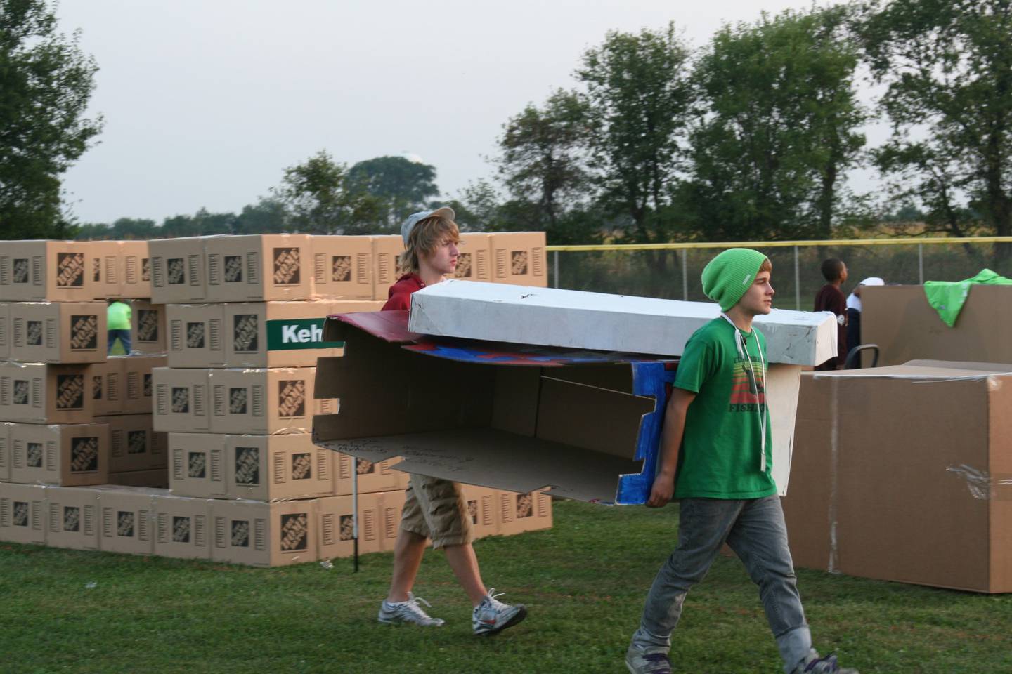 MorningStar Mission in Joliet is inviting people to experience homelessness for one night in its "Box City of Hope" event on Sept. 8. The event will include dinner, a program and sleeping outdoors underneath a box. Pictured: Attendees from a 2009 "Box City of Hope" event prepare to set up their box for the night.