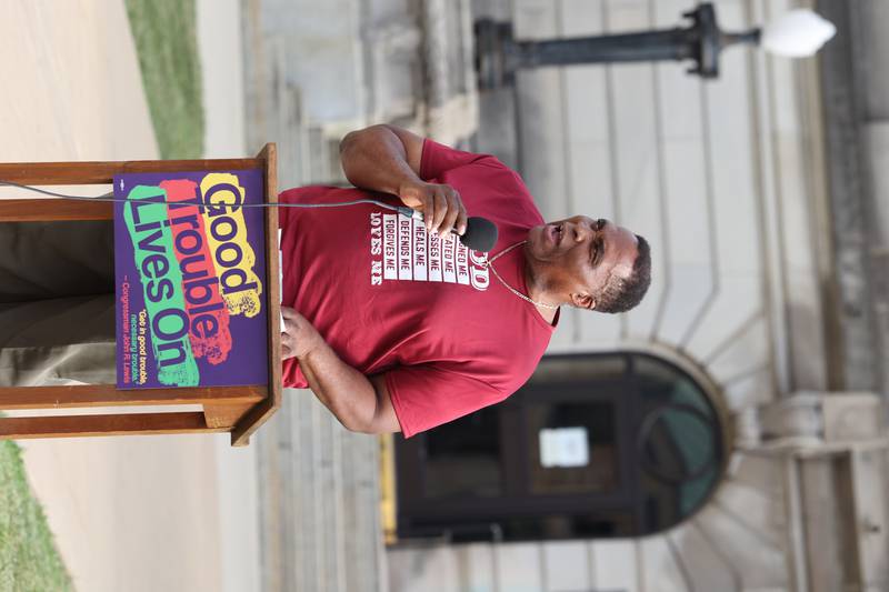 Robert Ellington-Snipes, former longtime Kankakee County Board member, reads aloud the final essay written by the late civil rights leader and congressman John Lewis during a "Good Trouble Lives On" rally held in Kankakee as part of a national day of peaceful protests on Thursday, July 17, 2025.