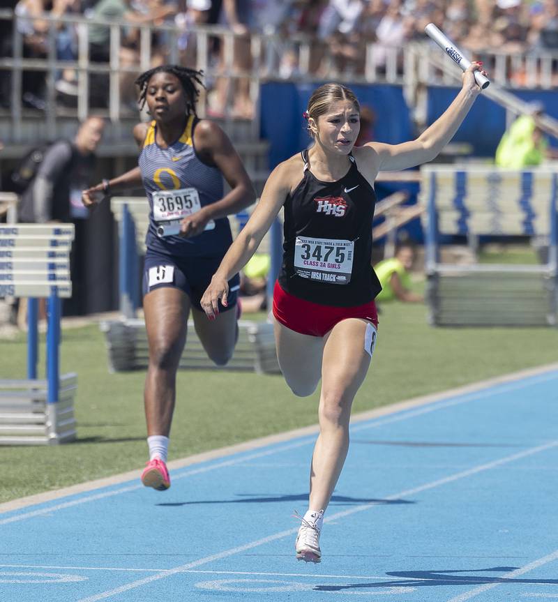 Huntley’s Victoria Evtimov crosses the finish line in the 3A 4x200 race Saturday, May 20, 2023 during the IHSA state track and field finals at Eastern Illinois University in Charleston.