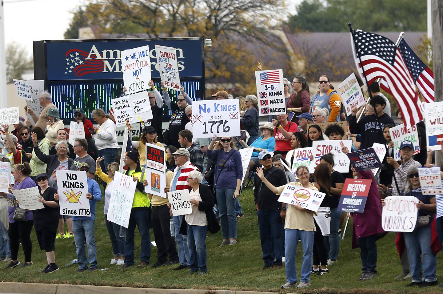 Protesters line Route 31 during a "No Kings” protest rally on Saturday, Oct. 18, 2025, in McHenry. The protest drew thousands of protesters to the area to protest the policies of President Donald Trump.
