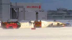 Delta Airlines plane flips on landing in Toronto and a badly hurt child is among 19 casualties