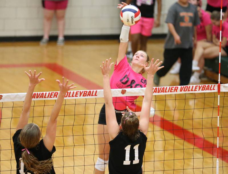 L-P's Aubrey Duttlinger sends a kill past Ottawa's Addison Duggan and teammate Bell Markey
