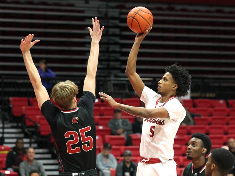 Northern Illinois' Philmon Gebrewhit shoots over Illinois Tech's Andrew Veon during their game Monday, Nov. 13, 2023, at the NIU Convocation Center in DeKalb.