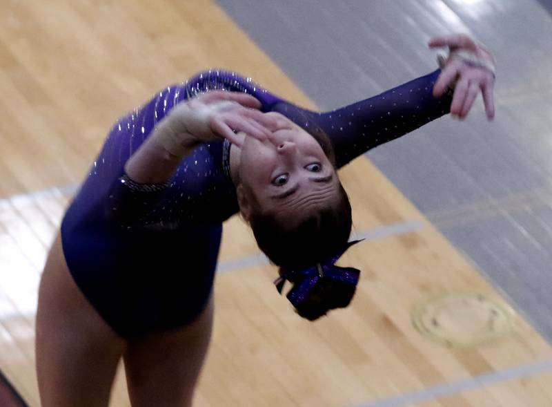 Downers Grove South's Emilie Kuchta   competes in the preliminary round of the vault on Friday, Feb. 21, 2025, during the IHSA Girls State Final Gymnastics Meet at Palatine High School.
