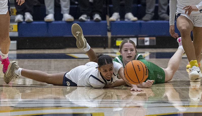 Sterling’s Alivia Gibson and Alleman’s Megan Hulke reach for a loose ball Thursday, Jan. 29, 2026.
