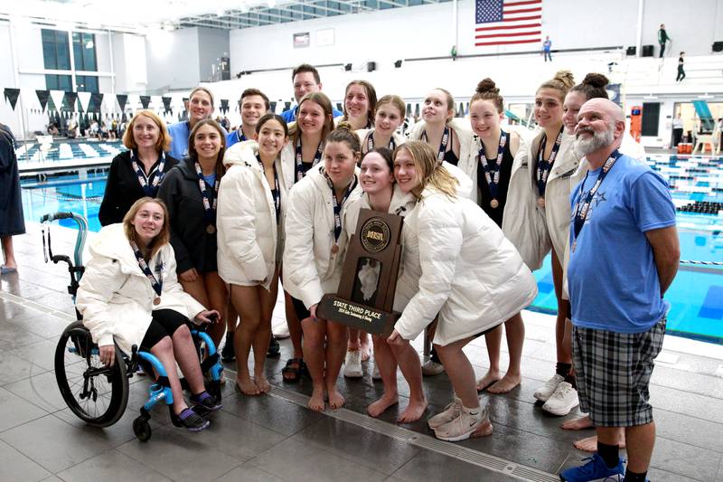 St. Charles North swimmers and coaches celebrate their third place finish in the IHSA Girls State Championships on Saturday, Nov. 16, 2024 at FMC Natatorium in Westmont.
