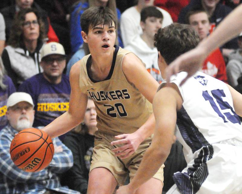 Serena's Beau Raikes dribbles as Lexington's Johnny Grunloh defends in the Marquette Christmas Tournament championship game on Friday, Dec. 28, 2023.