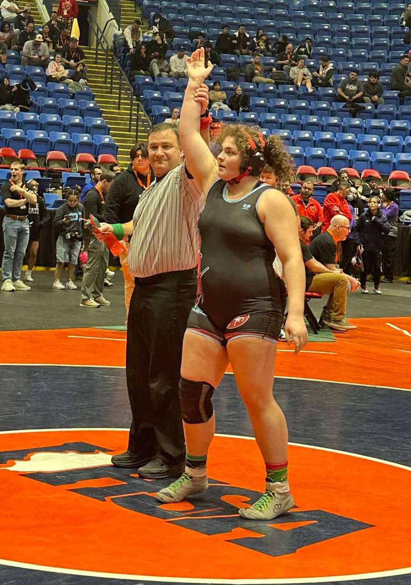 Ottawa junior Juliana Thrush has her hand raised after a quarterfinal victory at 235 pounds at the IHSA Girls Wrestling State Finals at Grossinger Motors Arena in Bloomington this past season.