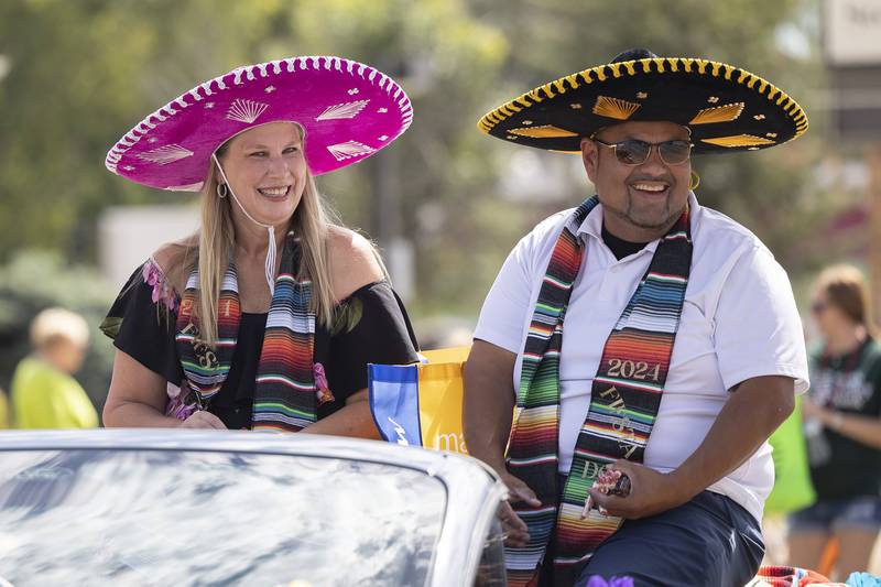 Don and Doña Adon and Jill Ramirez make their way through the Fiesta Days parade Saturday, Sept. 14, 2024.