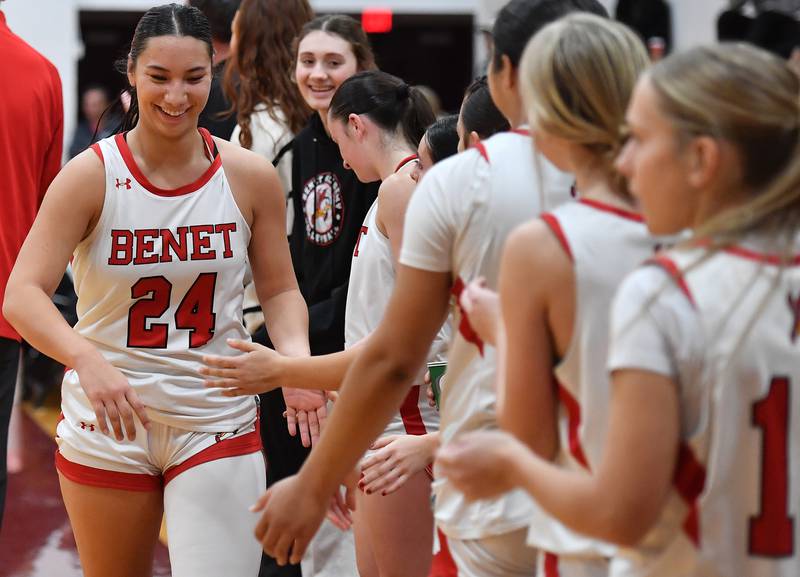 Benet’s Emma Briggs is greeted by teammates as she leaves the game in the fourth quarter of the Montini Christmas Tournament championship game against Marist on December 27, 2025 at Montini Catholic High School in Lombard.