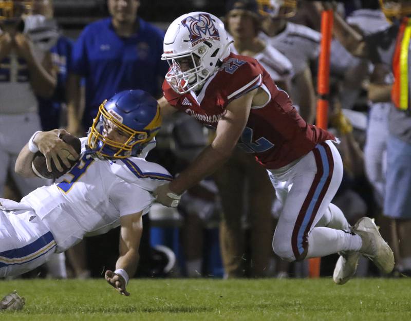 Marian Central's Matt Lajb, right, tackles Johnsburg's Anthony Bravieri during a non-conference football game Friday, Sept. 2, 2022, between Marian Central and Johnsburg at Marian Central High School.