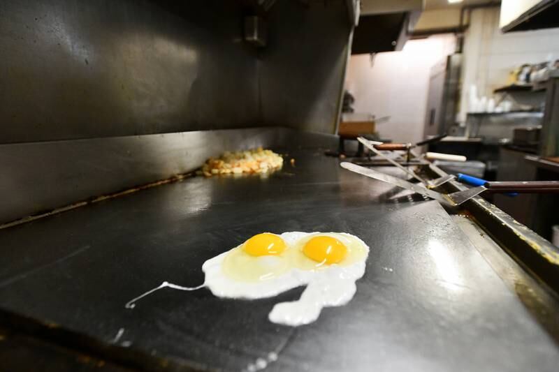 An order of fried eggs cook at Carlo's Restaurant in Kankakee during morning service on Feb. 25, 2025. Owner Jerrimy Robinson said since late October, the cost of eggs has increased by 150%.
