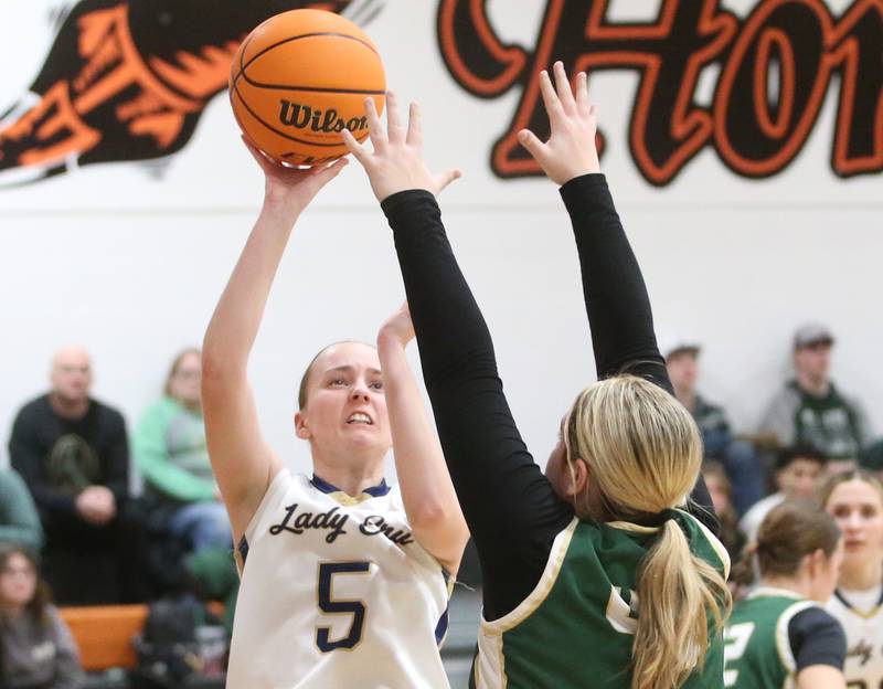 Marquette's Chloe Larson eyes the hoop as St. Bede's Savannah Bray defends during the Tri-County Conference championship game on Thursday, Jan. 23, 2025 at Roanoke-Benson High School.