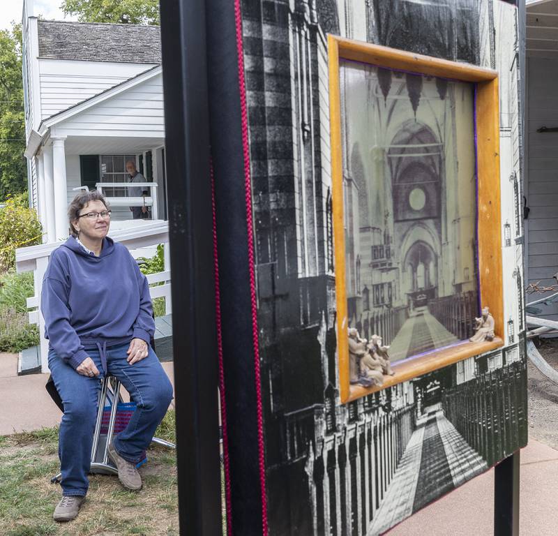 Rosalie Koldan of Amboy showcases her art Sunday, Sept. 7, 2025, at the Grand Detour Arts Festival. Koldan creates multimedia works like this cathedral scene.