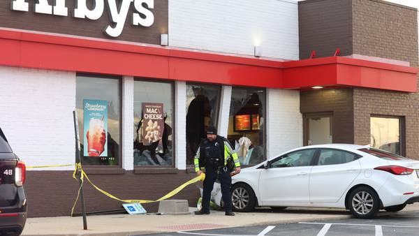Photos: Car strikes Arbys in Peru