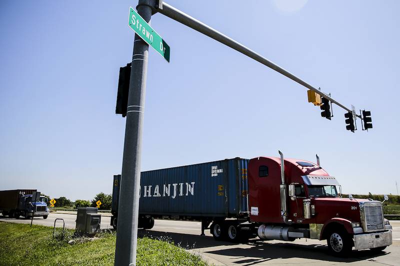 A semitrailer turns onto Walter Strong Drive off of Route 53 Aug. 15 in Elwood. County officials anticipate a greater regional effort in 2015 in addressing the area's ever-growing semitrailer traffic problem from the two trucking intermodals in Joliet and Elwood.