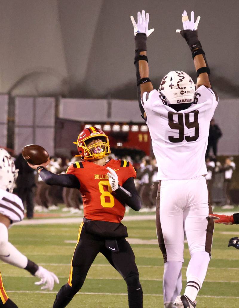 Batavia's Michael Vander throws over Mt. Carmel’s Braeden Jones during their Class 8A state championship game Saturday, Nov. 30, 2024, in Hancock Stadium at Illinois State University in Normal.