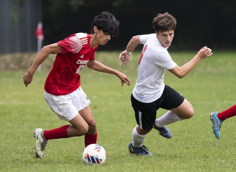 Dundee-Crown's Miguel Pena gets past Huntley's Jack Breunig during their game on Thursday, October 6, 2022 at Dundee-Crown High School in Carpentersville. Dundee-Crown won 1-0.