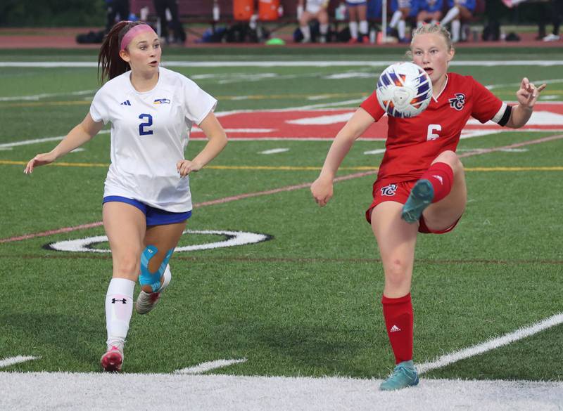 Timothy Christian's Mia Schilf kicks the ball out of the air in front of Johnsburg's Devynn Michel Thursday, June 5, 2025, during their IHSA Class 1A state semifinal game at North Central College in Naperville.
