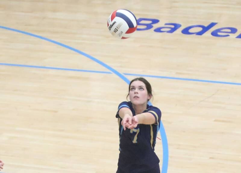 Marquette's Maisie Lyons hits the ball in the air against Woodland on Thursday, Oct. 19, 2023 at Bader Gym.