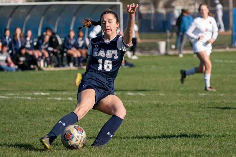 Oswego East's Ashley Gumm (18) play the ball against Oswego during a soccer match at Oswego East High School on Thursday, Apr 6, 2023.
