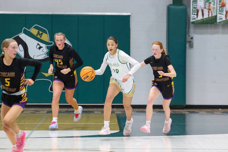 Bishop McNamara's Trinitee Thompson break away with the ball during the Fightin' Irish's 67-27 victory over Chicago Christian on Monday, Jan. 26, 2026.