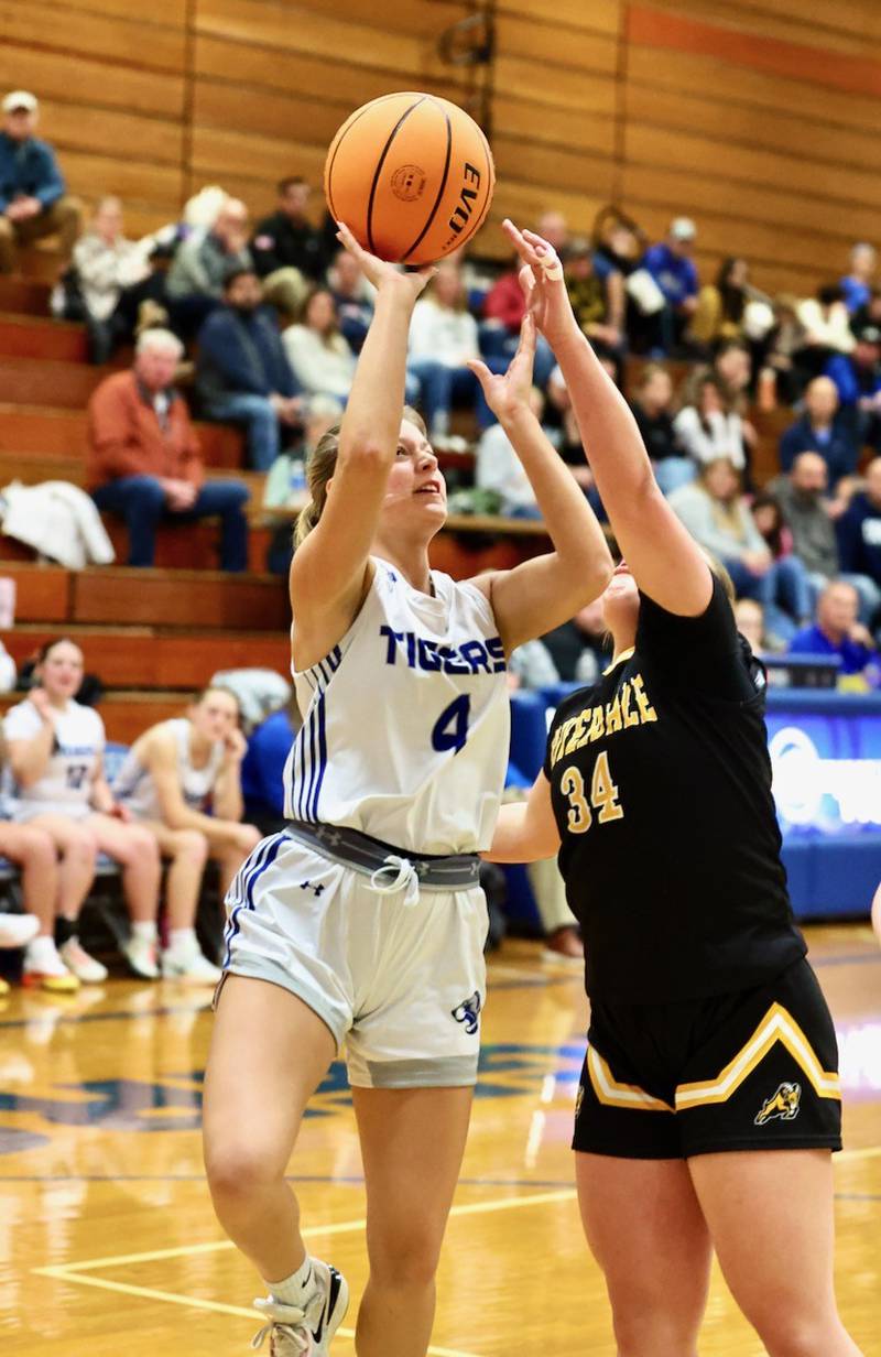 Princeton's Madie Gibson shoots over Riverdale's Maggie Larson Tuesday night at Prouty Gym.