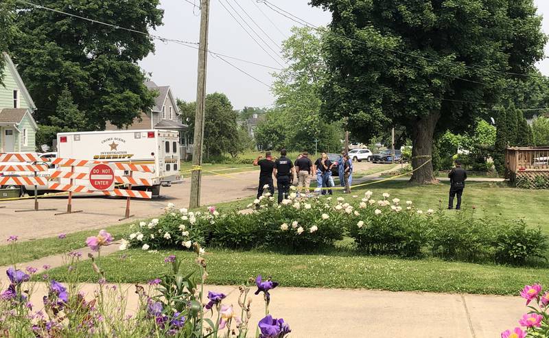 Investigators from the McHenry County Major Investigation Assistance Team (MIAT) on Sunday, June 4, 2023, on the 700 block of Dewey Street, Harvard. A Harvard officer shot and killed a man police said had fatally stabbed a woman to death at about 11:30 p.m. Saturday.