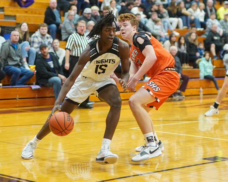 Kaneland’s Freddy Hassan (15) drives the baseline against Sandwich’s Jack Philips (32) during a first round basketball game in the 60th annual Plano Christmas Classic Tournament Plano High School on Wednesday, Dec 27, 2023.