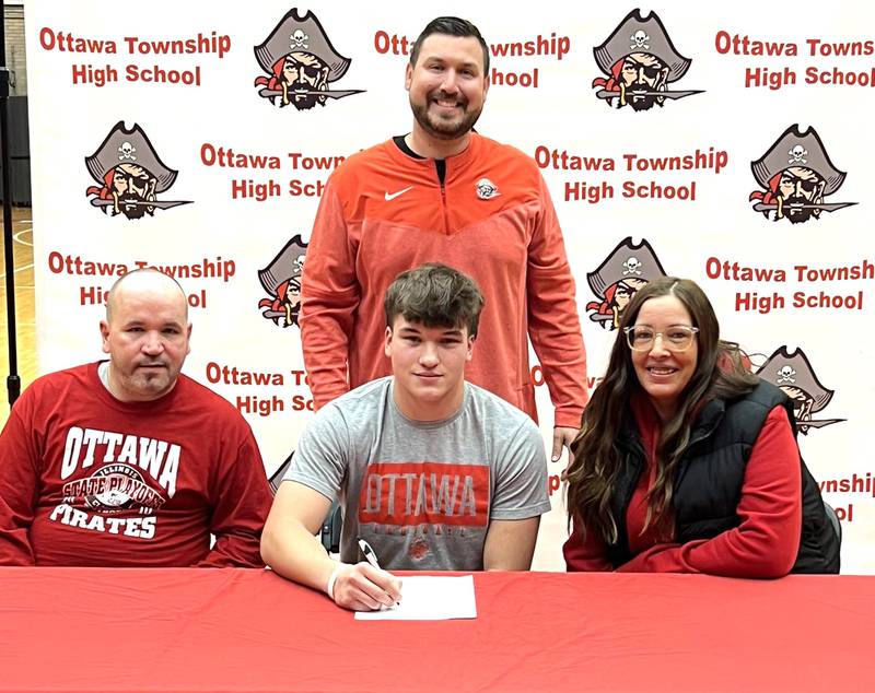 Ottawa’s Luke Boaz has signed on to continue his education at Millikin University in Decatur and his football career at the NCAA Division III level with the Big Blue. Boaz, a running back/linebacker for the Pirates and second-team selection to the 2023 Times All-Area Football Team, is pictured seated at his signing ceremony bookended by family, with Ottawa football coach Chad Gross standing behind.