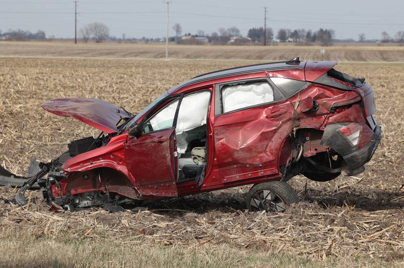 A badly damaged vehicle sits in a cornfield on the east side of Somonauk Road south of McGirr Road Wednesday, March 25, 2026, after a two vehicle crash near Hinckley.
