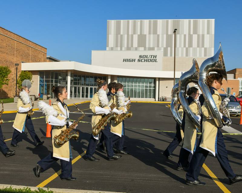 Lemont’s marching band makes their way to the Downers Grove South football field on Saturday Oct. 5, 2024, for the Downers Grove South Marching Mustangs Music Bowl.