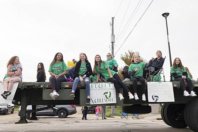 The Rock Falls volleyball team watches on from their homecoming float Thursday, Sept. 21, 2023.