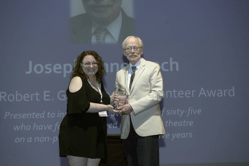 Joe Ennenbach (right) of La Salle accepts the Robert E. Gard Superior Volunteer Award from Dorinda Toner, a board member of the American Association of Community, at the association’s award ceremony on June 16, 2023. Stage 212 in La Salle is honoring Ennenbach again at a Nov. 25 banquet celebrating the company’s 55th anniversary. Ennenbach has been a Stage 212 fixture since its inception.