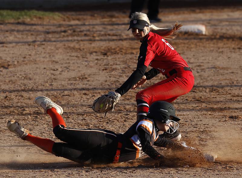 McHenry's Gianna Buske slides into second base as Barrington’s Nikki Vojack tries to tag her during a non-conference softball game Friday, April 1, 2022, between McHenry and Barrington at Barrington High School.