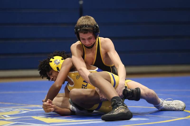 Joliet West’s Nick Murdock-Schey works over Joliet Central’s Bio Contreras in the 106-pound weight match at Joliet Central on Friday, Jan 31, 2025.