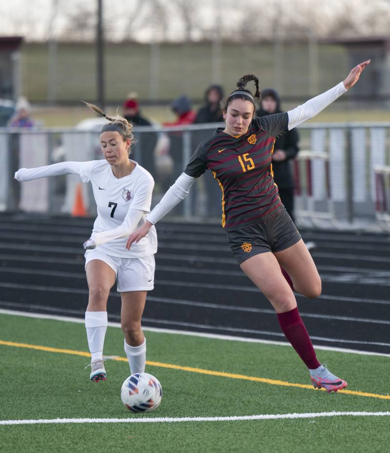 Prairie Ridge's Grace Turman, left, passes past Richmond-Burton's Brianna Maldonado during their game on Wednesday, April 5, 2023 at Richmond-Burton High School in Richmond. Ryan Rayburn for Shaw Local