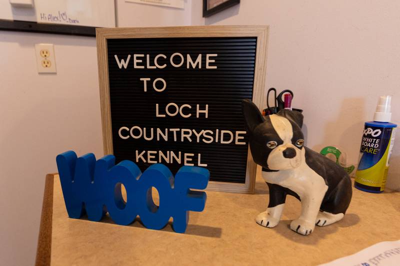 Signs sit on desk of Laura Loch on Friday, June 27, 2025 at Loch Countryside Kennel in Peru.