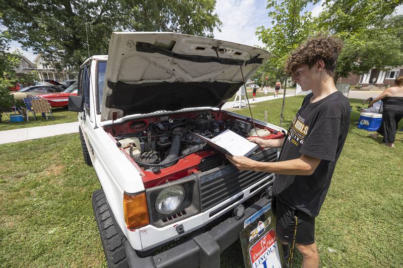 Leroy Higley, 15, of Dixon, shows off his 1988 Dodge Raider Friday, July 4, 2025, at Dixon’s Petunia Fest car show. Higley liked the uniqueness of the ride so he recently bought it from a local seller.